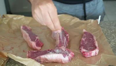 Season generously with kosher salt, pepper, and garlic powder on both sides.