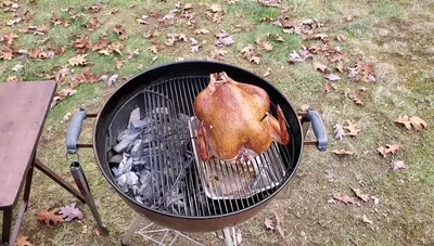 Continue grilling until the turkey timer pops and the meat thermometer indicates it's done.