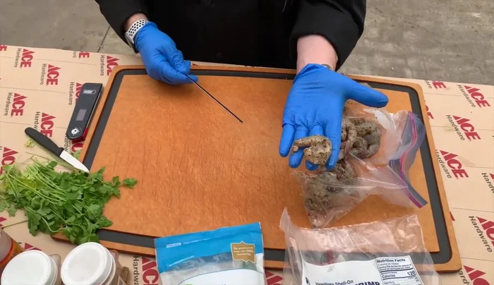 Skewer the shrimp: Thread shrimp onto skewers, leaving a little air gap between each shrimp.