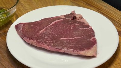 Season the steak with kosher salt, black pepper, and Spike seasoning on both sides.