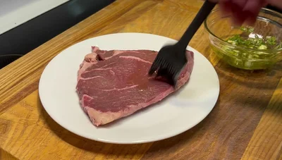 Season the steak with kosher salt, black pepper, and Spike seasoning on both sides.