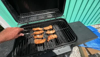 Add more barbecue sauce to the chicken.