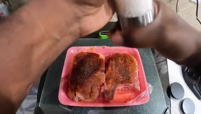 Place the seasoned pork chops in a bag and let them marinate for a couple of hours.