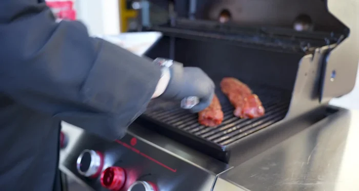 Place the pork tenderloins on the grill and cook for 10 minutes on the first side.