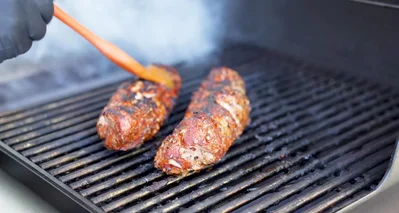 Brush the rested tenderloins with Blues Hog honey mustard.