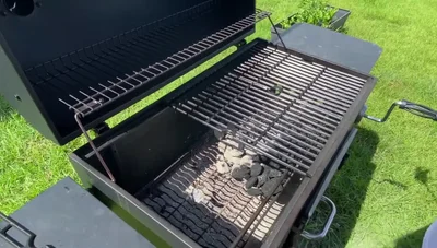 Place an aluminum pan with apple juice next to the charcoal to keep the ribs moist.