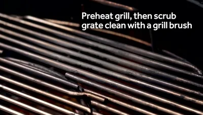 Oil the grill grate by rubbing an oil-soaked paper towel all over it.