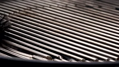 Oil the grill grate by rubbing an oil-soaked paper towel all over it.