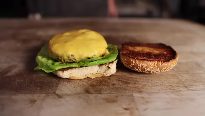 Assemble the burgers: Spread burger sauce on the bottom bun, add lettuce, patty, onions, tomatoes, pickles, and top bun.
