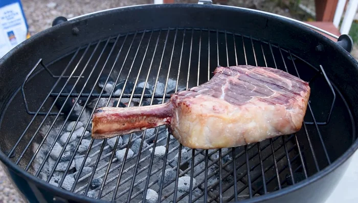 Cook until the steak reaches 115 degrees F (internal temperature) for medium-rare, flipping halfway through around 90 degrees F.