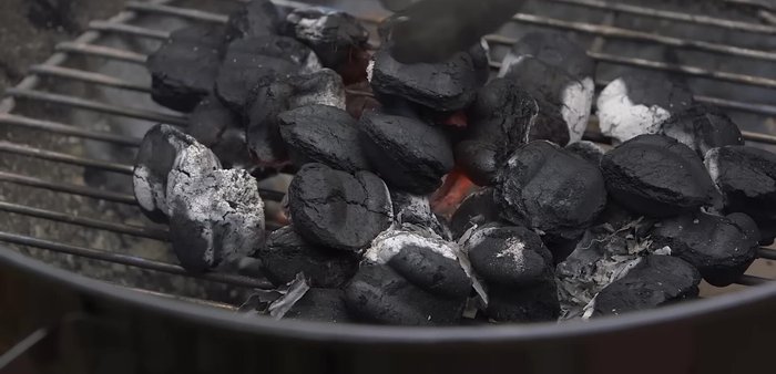 Add more briquettes if needed: If you need more briquettes, add them now while the fire is going strong.