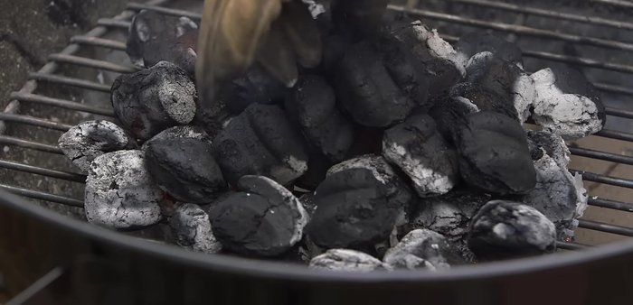 Add more briquettes if needed: If you need more briquettes, add them now while the fire is going strong.