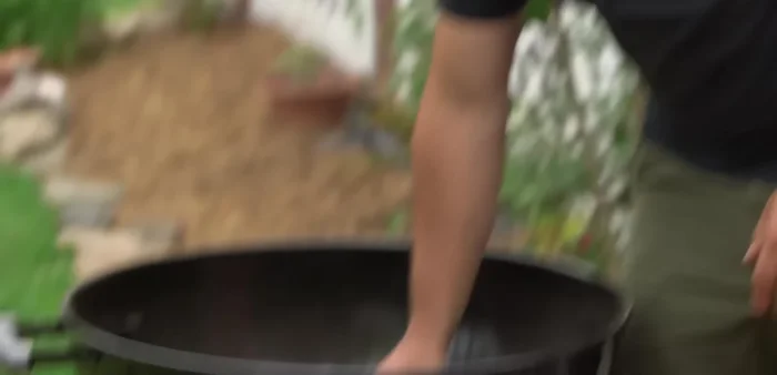 Dampen the newspaper slightly. Don't make it too wet or too dry; just enough to help it burn slowly.