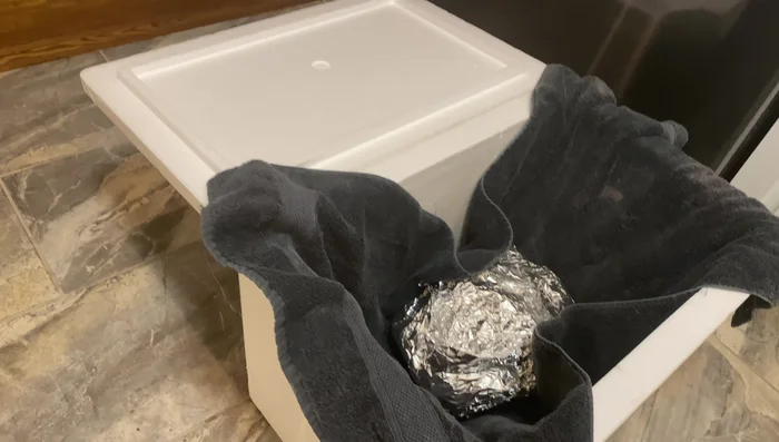 Rest the brisket (1 hour): Wrap the cooked brisket in a towel and place it in a cooler to rest for about an hour.