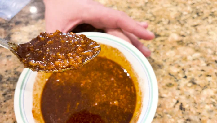 Make the marinade. Combine salt, pepper, smoked paprika, crushed garlic cloves, and olive oil. Mix well and let it sit for a few minutes.