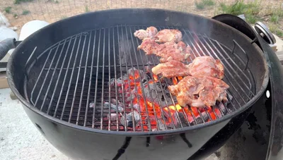 Sear both sides of the chicken thighs until slightly charred.