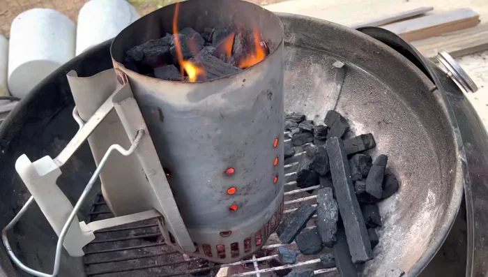 Prepare the grill with lump charcoal.
