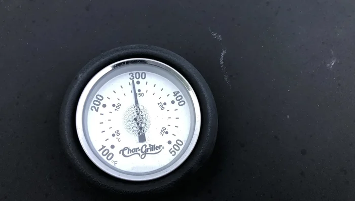 After approximately 1 hour and 15 minutes, check the ribs' internal temperature. They should be above 140°F for pork.