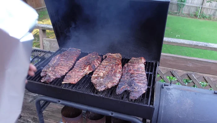 Apply the Texas Cheat Method: Wrap each rib in foil (meat side down, shiny side up), adding a light soy sauce for moisture. Cook for another 20-30 minutes.