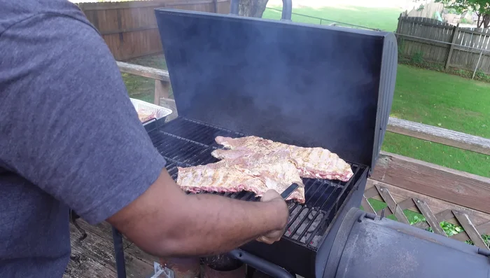 Grill for 15 minutes, then flip the ribs.