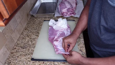 Rub the ribs with olive oil, Lowry seasoned salt, onion powder, garlic powder, and black pepper.