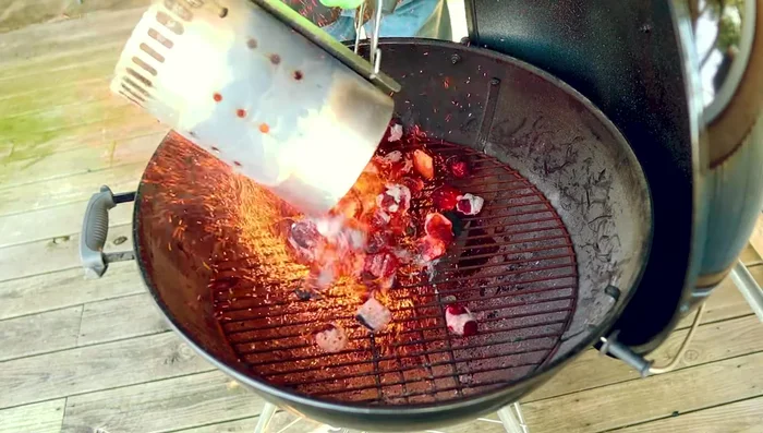 Light a full chimney of charcoal and pour it into the grill.