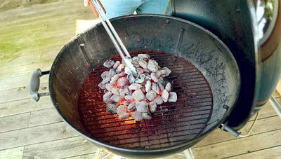 Spread the charcoal slightly, concentrating the heat.