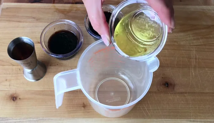 Prepare the marinade: Combine olive oil, balsamic vinegar, soy sauce, bourbon, powdered ginger, pecan liquid smoke in a bowl.