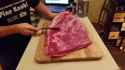 Season the brisket liberally with salt, pepper, and rubs (avoid sugar-based rubs).