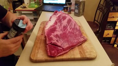 Season the brisket liberally with salt, pepper, and rubs (avoid sugar-based rubs).