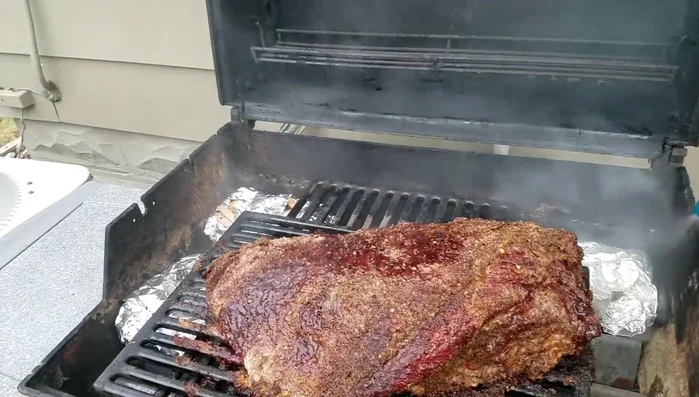 Spray with apple cider vinegar mixture: Every 45 minutes, spray the brisket with a 50/50 mixture of water and apple cider vinegar to keep it moist.