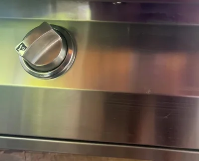 Cook for 90 seconds on high, then reduce burners directly under the pizza to medium to prevent burning.