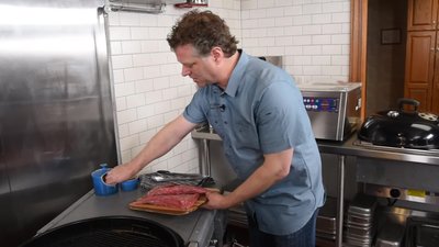 Set up your grill for indirect heat: hot coals on one side, no coals on the other.