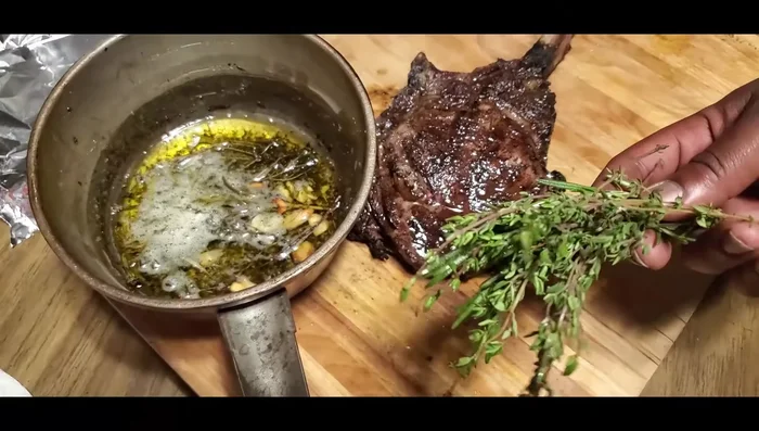 Brush the rested steak with the compound butter before slicing and serving.