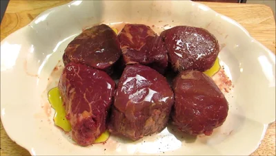 Generously season both sides of the steaks with kosher salt and freshly ground black pepper.