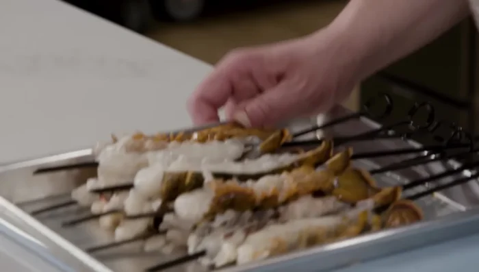 Brush with Butter: Brush the lobster tails with the reserved lemony garlic butter. This adds flavor and helps prevent sticking.