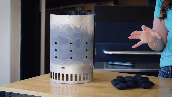 Add charcoal to the chimney.