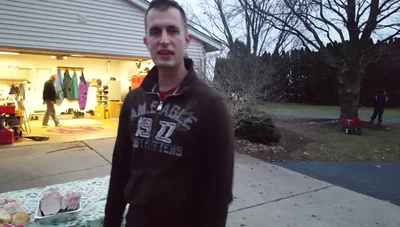 Season the burgers again while they grill on the second side.