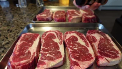 Spray steaks with avocado oil and apply a beef rub.