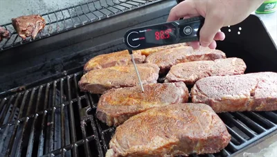 Continue cooking on indirect heat until the steaks reach 115-120°F (46-49°C).