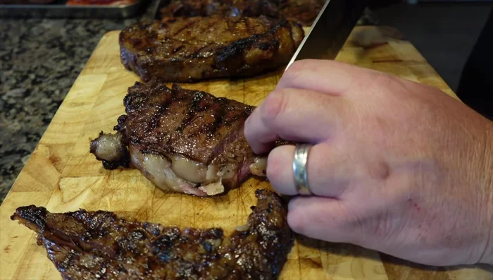 Remove steaks from grill and let them rest for at least 10-15 minutes before slicing and serving.