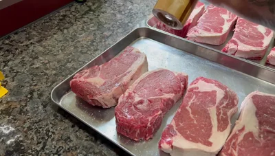 Spray steaks with avocado oil and apply a beef rub.