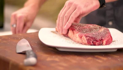 Optional: Dunk the seasoned steak in clarified butter before grilling for enhanced flavor and browning.