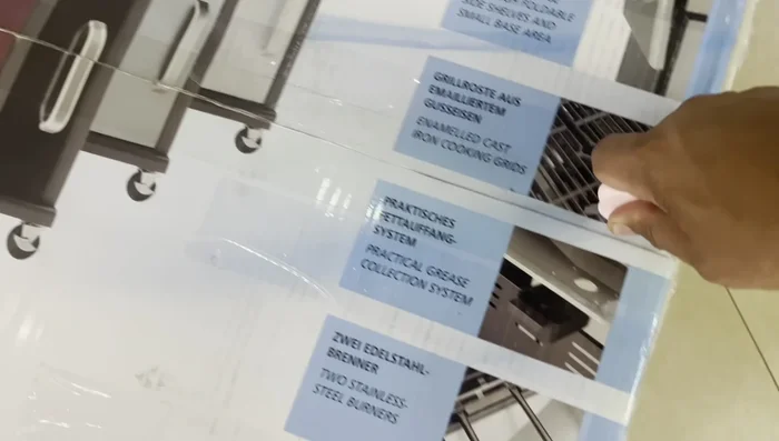 Unboxing the grill and manual.