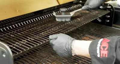 Spray the top of the grates with a food-contact surface approved cleaner and wipe down with a towel to remove residue and oils.