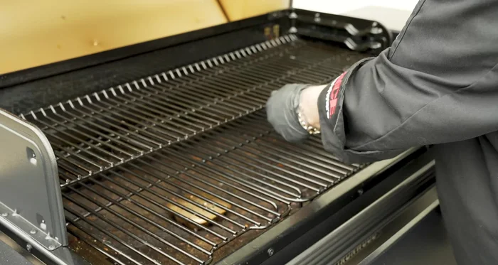 Reassemble the grates onto the Traeger grill.