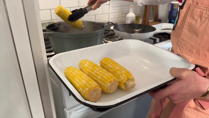 Check for doneness: The corn should be a bright yellow color.