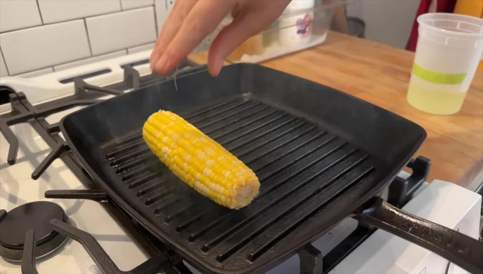 Grill the corn, rotating every few seconds, until you achieve the desired color and grill marks.