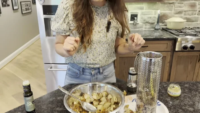 Place vegetables into the rolling grill baskets. A rolled-up paper plate can help facilitate easy transfer.