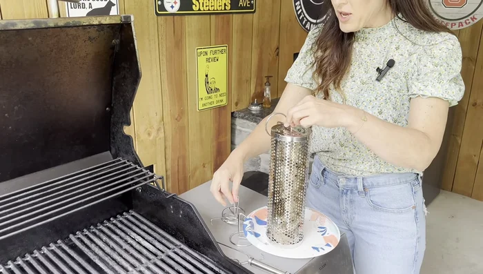 Position the rolling grill baskets on the grill grates. You can use the included stands or place them directly on the grates.